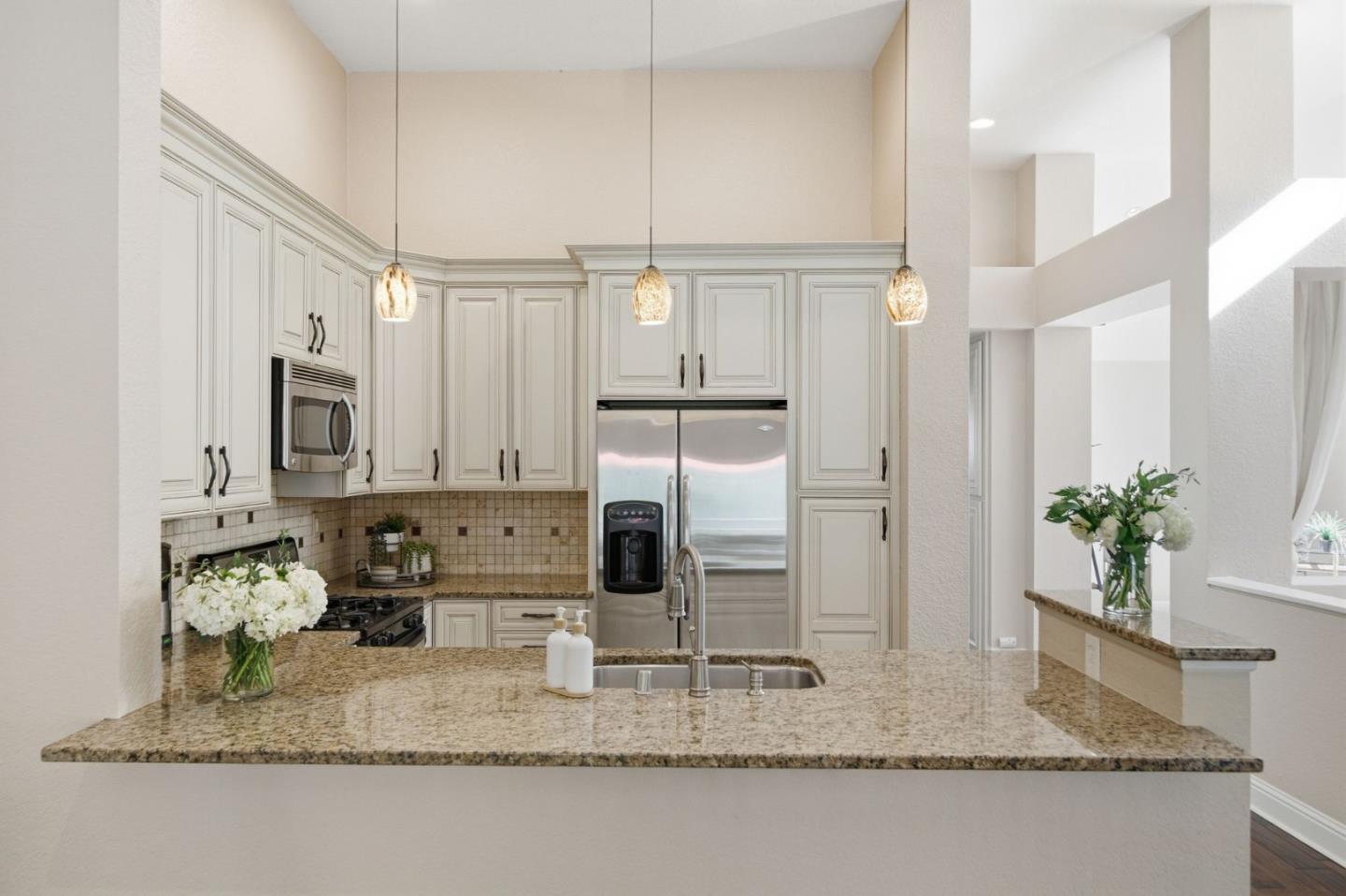 3030 Lakemont Drive, Unit 3 San Ramon, CA 94582 - Photo 2 of 43 a kitchen with kitchen island granite countertop a sink a counter top space and cabinets