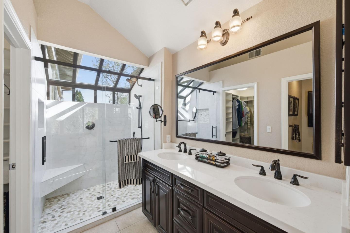 3030 Lakemont Drive, Unit 3 San Ramon, CA 94582 - Photo 26 of 43 a bathroom with a double vanity sink mirror and shower