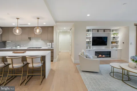a kitchen with a table and chairs in it