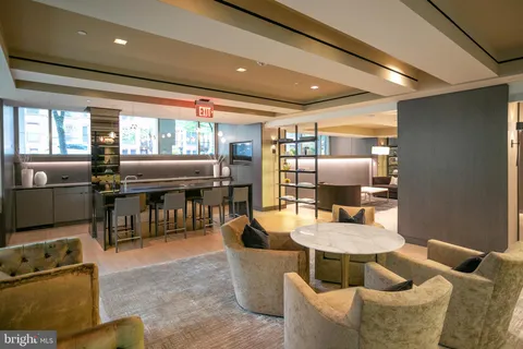 a living room with fireplace furniture and a flat screen tv