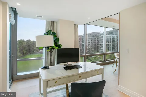 a view of a workspace with furniture