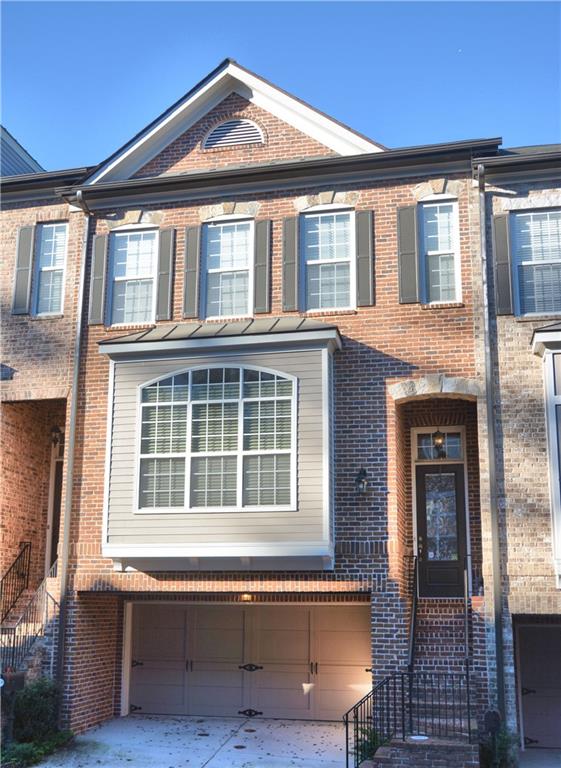 2672 Rivers Edge Drive Northeast Atlanta, GA 30324 - Photo 1 of 1 Rare, 2-Car Executive Brick, Gated Townhome, with Creek Views at Exclusive Rivers Edge at Peachtree Creek