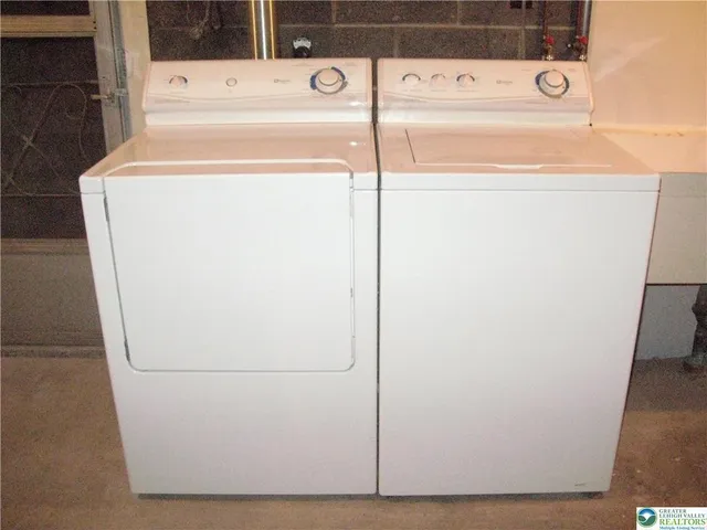 a view of a porch with a table and chairs