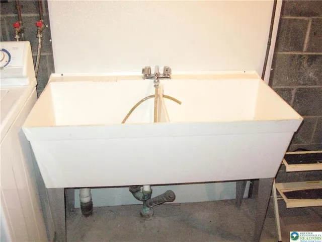 a view of an empty room with wooden walls