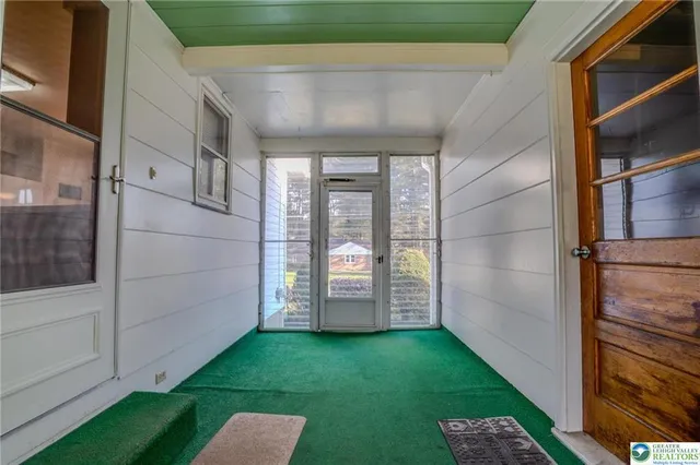 a view of a room with wooden walls
