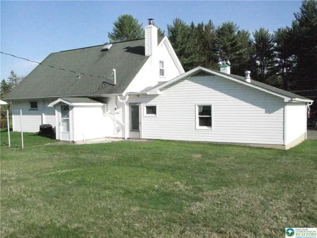 a view of a door with wooden floor