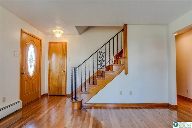 a view of entryway with wooden floor