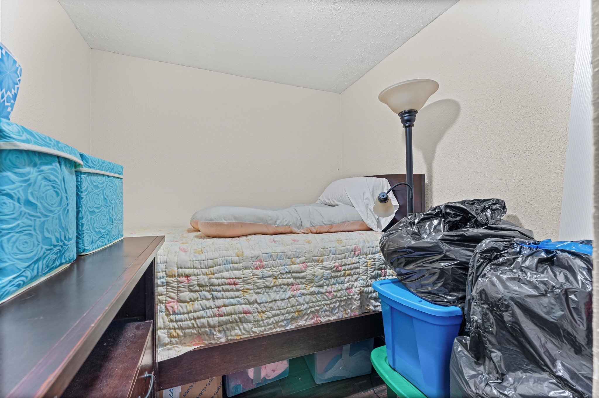 16032 1/2 Ridlon Street Channelview, TX 77530 - Photo 14 of 44 a view of a bed in a room
