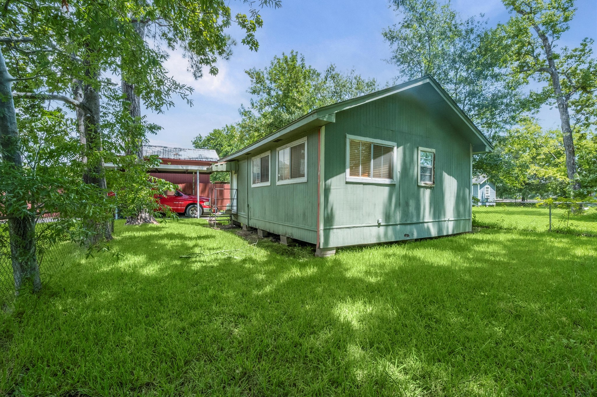 16032 1/2 Ridlon Street Channelview, TX 77530 - Photo 21 of 44 a front view of house with yard and trees