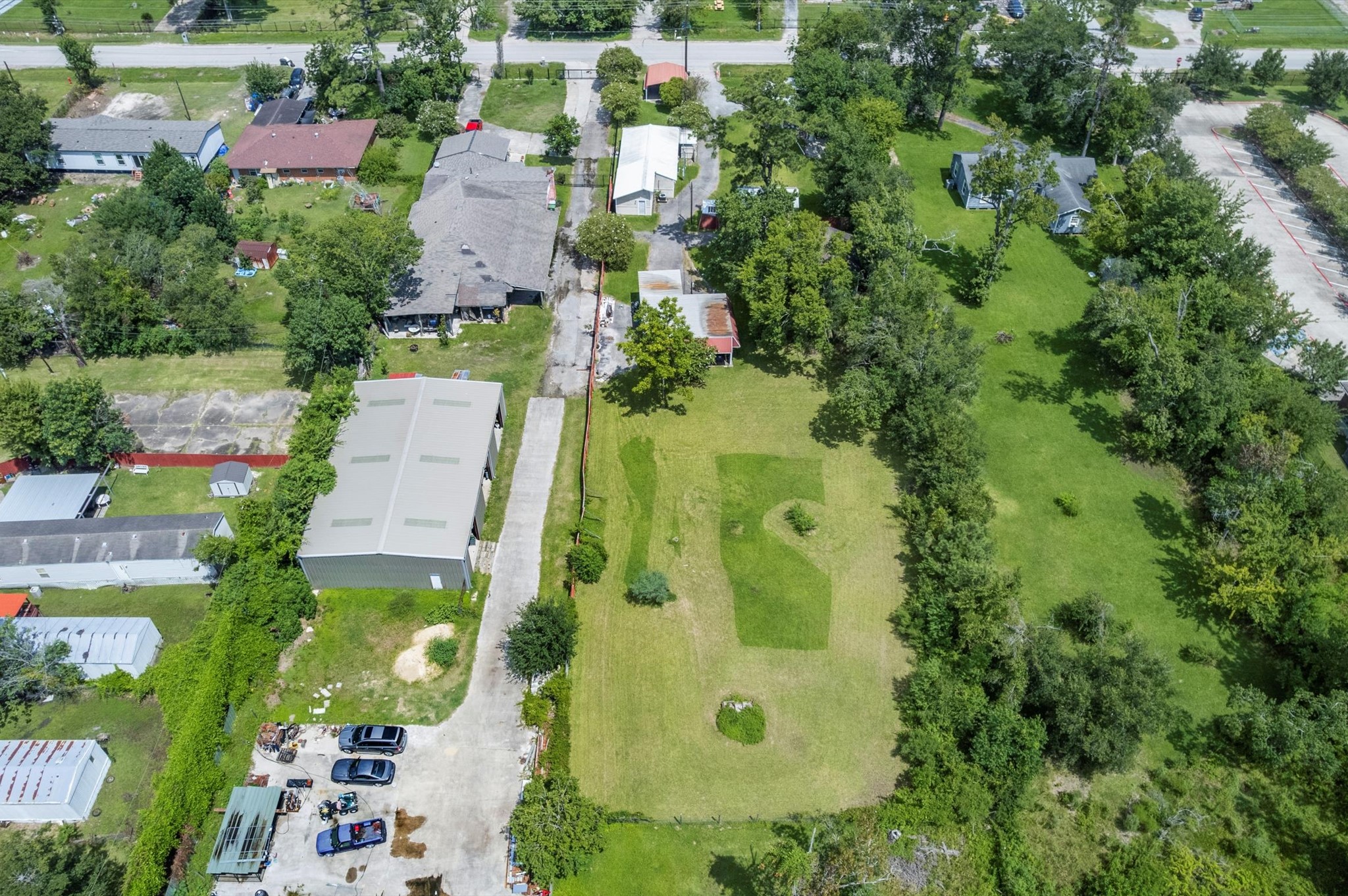 16032 1/2 Ridlon Street Channelview, TX 77530 - Photo 39 of 44 an aerial view of residential house with outdoor space and trees all around