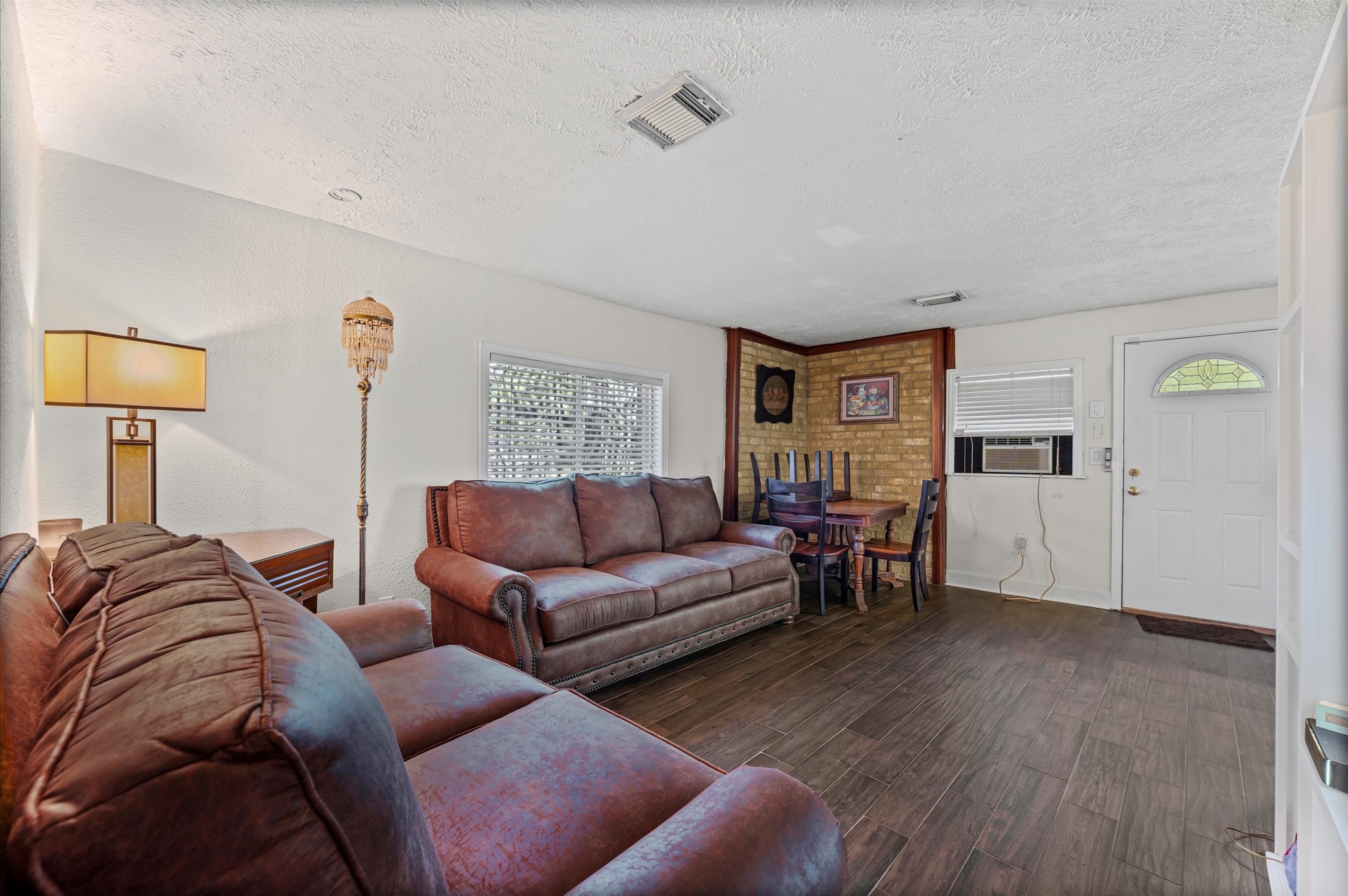 16032 1/2 Ridlon Street Channelview, TX 77530 - Photo 6 of 44 a living room with furniture and wooden floor