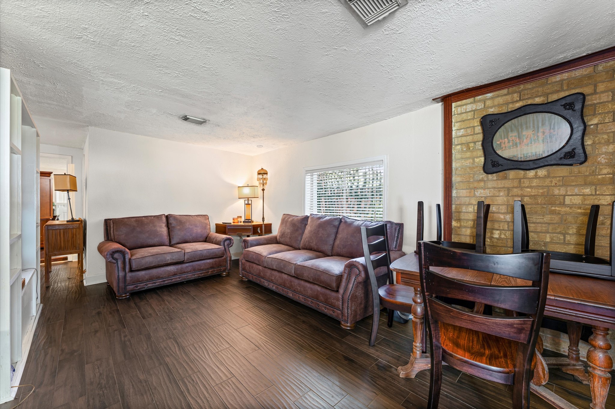 16032 1/2 Ridlon Street Channelview, TX 77530 - Photo 7 of 44 a living room with furniture and a flat screen tv
