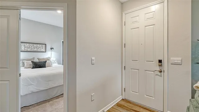 a bedroom with a bed and hallway