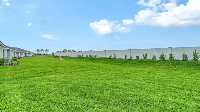 a view of a golf course with a lake
