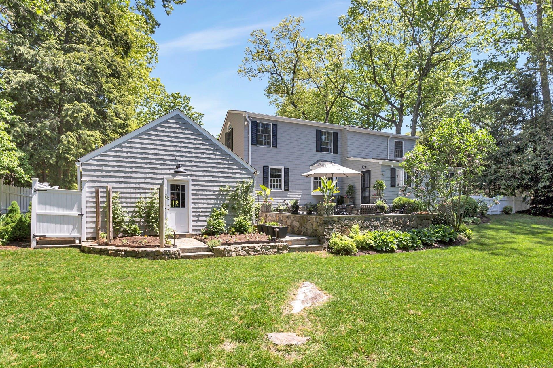 31 Range Road Rowayton, CT 06853 - Photo 22 of 24 a front view of house with yard and outdoor seating