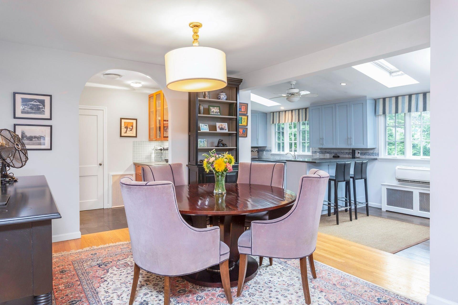 31 Range Road Rowayton, CT 06853 - Photo 8 of 24 a view of a dining room with furniture a chandelier and wooden floor