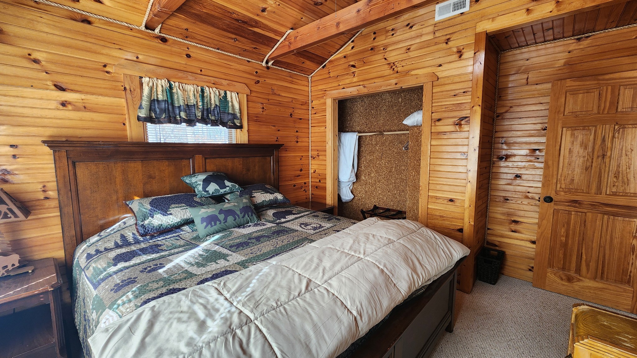 5615 Eastport Road Alpine, TN 38543 - Photo 13 of 83 a bed sitting in a bedroom next to a window