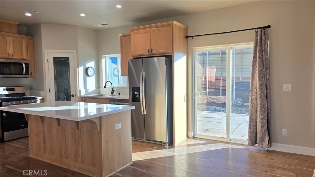 6396 Diamond Paradise, CA 95969 - Photo 18 of 36 a kitchen with stainless steel appliances granite countertop a refrigerator a sink and a stove