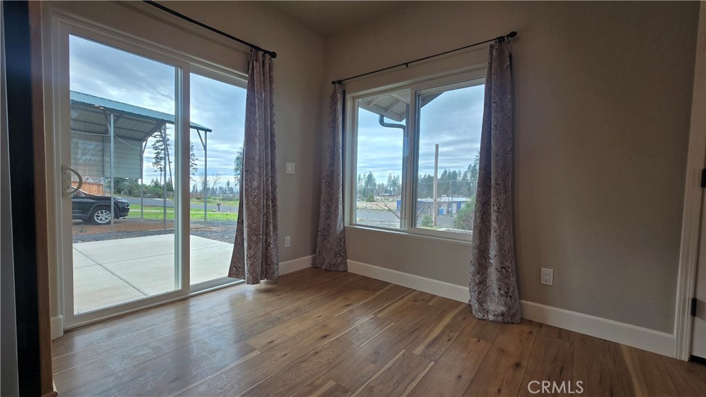 6396 Diamond Paradise, CA 95969 - Photo 25 of 36 a view of an empty room with wooden floor and a window