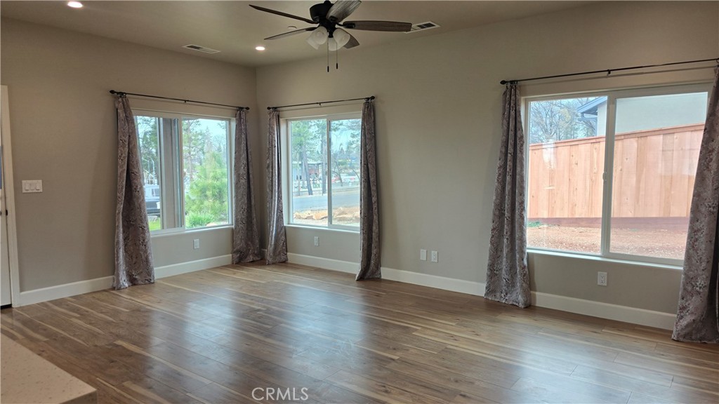 6396 Diamond Paradise, CA 95969 - Photo 26 of 36 an empty room with wooden floor fan and windows