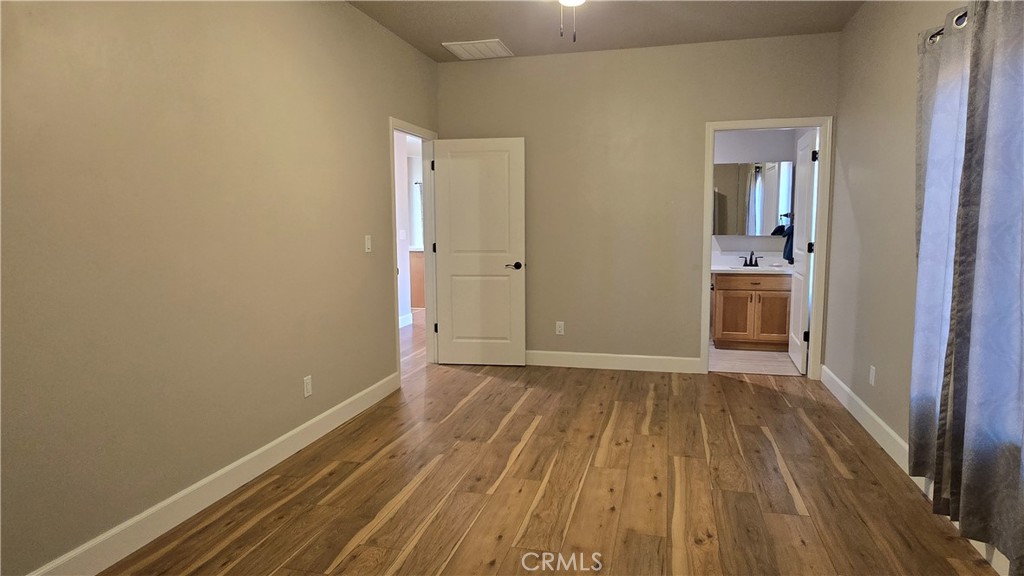 6396 Diamond Paradise, CA 95969 - Photo 29 of 36 a view of an empty room with wooden floor and a window
