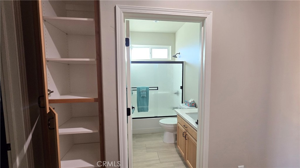 6396 Diamond Paradise, CA 95969 - Photo 34 of 36 a bathroom with a granite countertop sink and a toilet