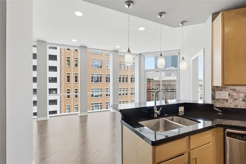 a kitchen with granite countertop a sink and a granite counter tops