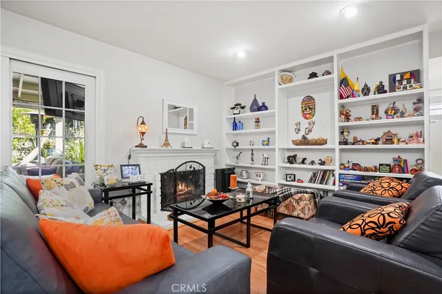 a living room with furniture fireplace and book shelf