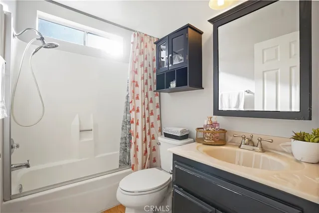 a bedroom with a bed chair and a window