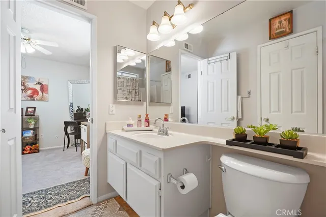 a bathroom with a sink a large mirror and a shower