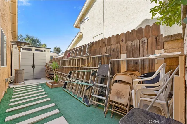 a balcony with table and chairs