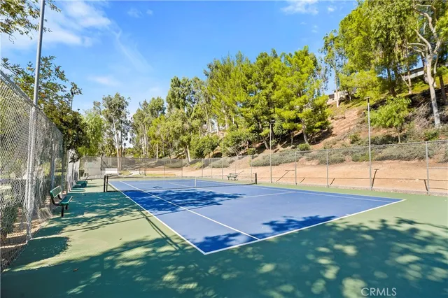 a view of yard with large trees