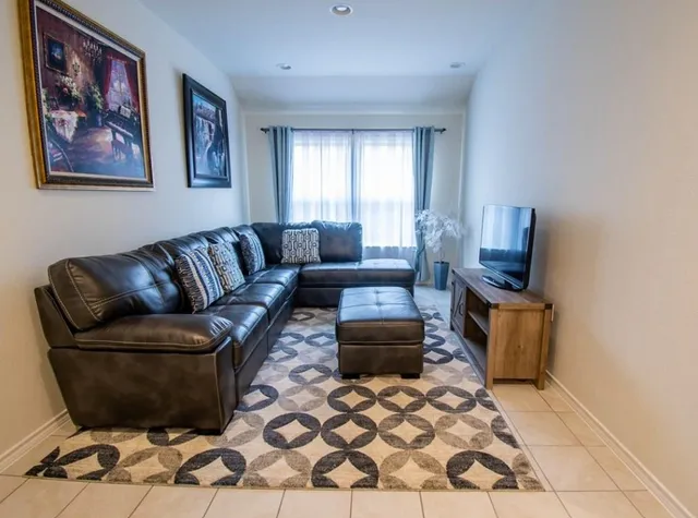 a living room with furniture and a window