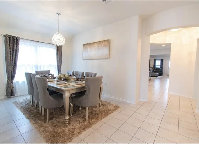 a view of a dining room with furniture