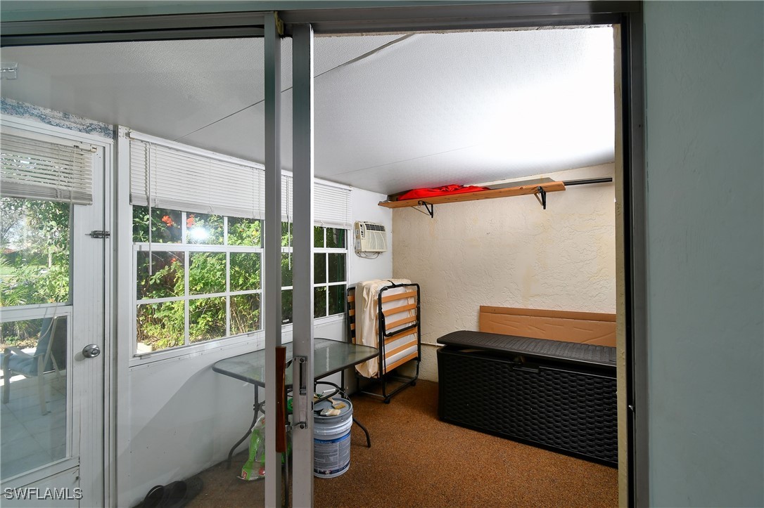 8 Park Ln Circle Lehigh Acres, FL 33936 - Photo 12 of 47 a room that has a bed and a window