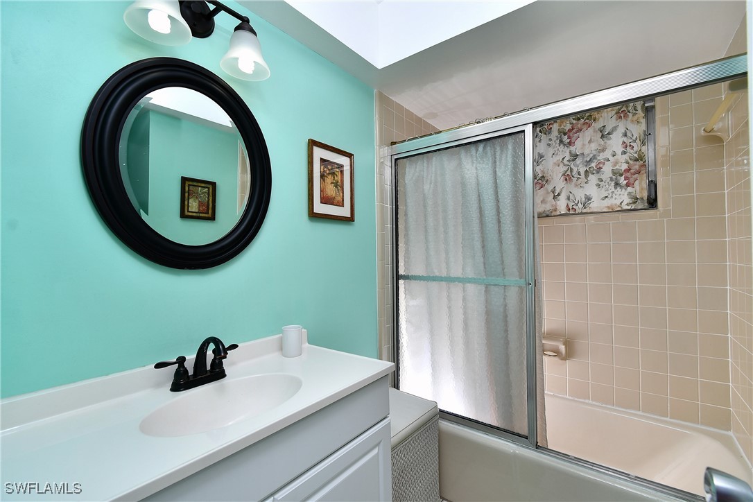 8 Park Ln Circle Lehigh Acres, FL 33936 - Photo 15 of 47 a bathroom with a sink and a mirror