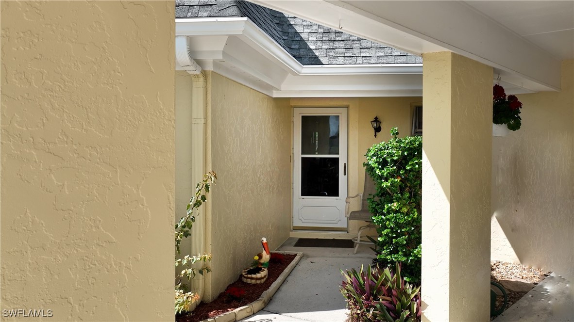8 Park Ln Circle Lehigh Acres, FL 33936 - Photo 2 of 47 front view of a house with a yard