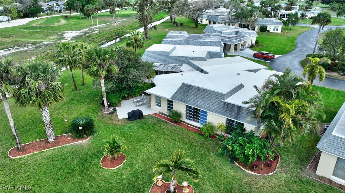 8 Park Ln Circle Lehigh Acres, FL 33936 - Photo 26 of 47 an aerial view of a house with garden