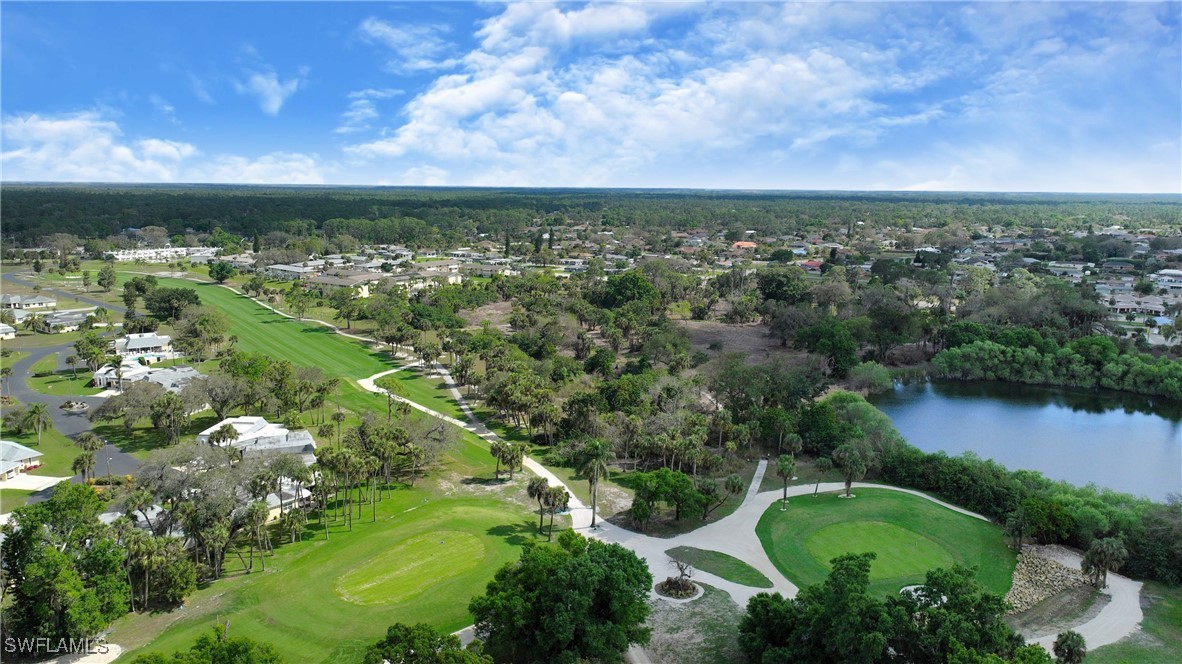 8 Park Ln Circle Lehigh Acres, FL 33936 - Photo 43 of 47 an aerial view of a houses with outdoor space and trees all around