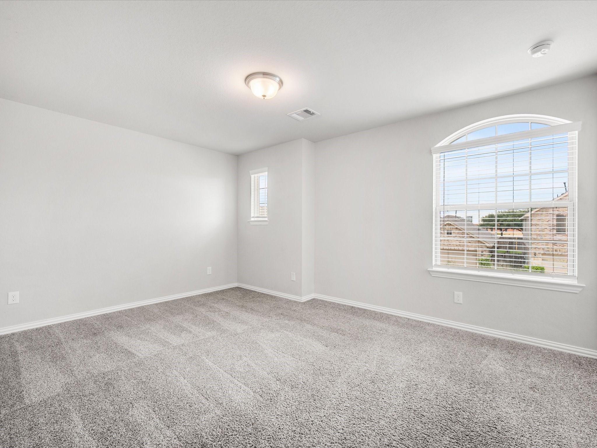 7123 Poppyseed Trail Spring, TX 77379 - Photo 20 of 30 Spacious secondary bedrooms with large windows and abundant natural light provide comfortable spaces everyone can enjoy.