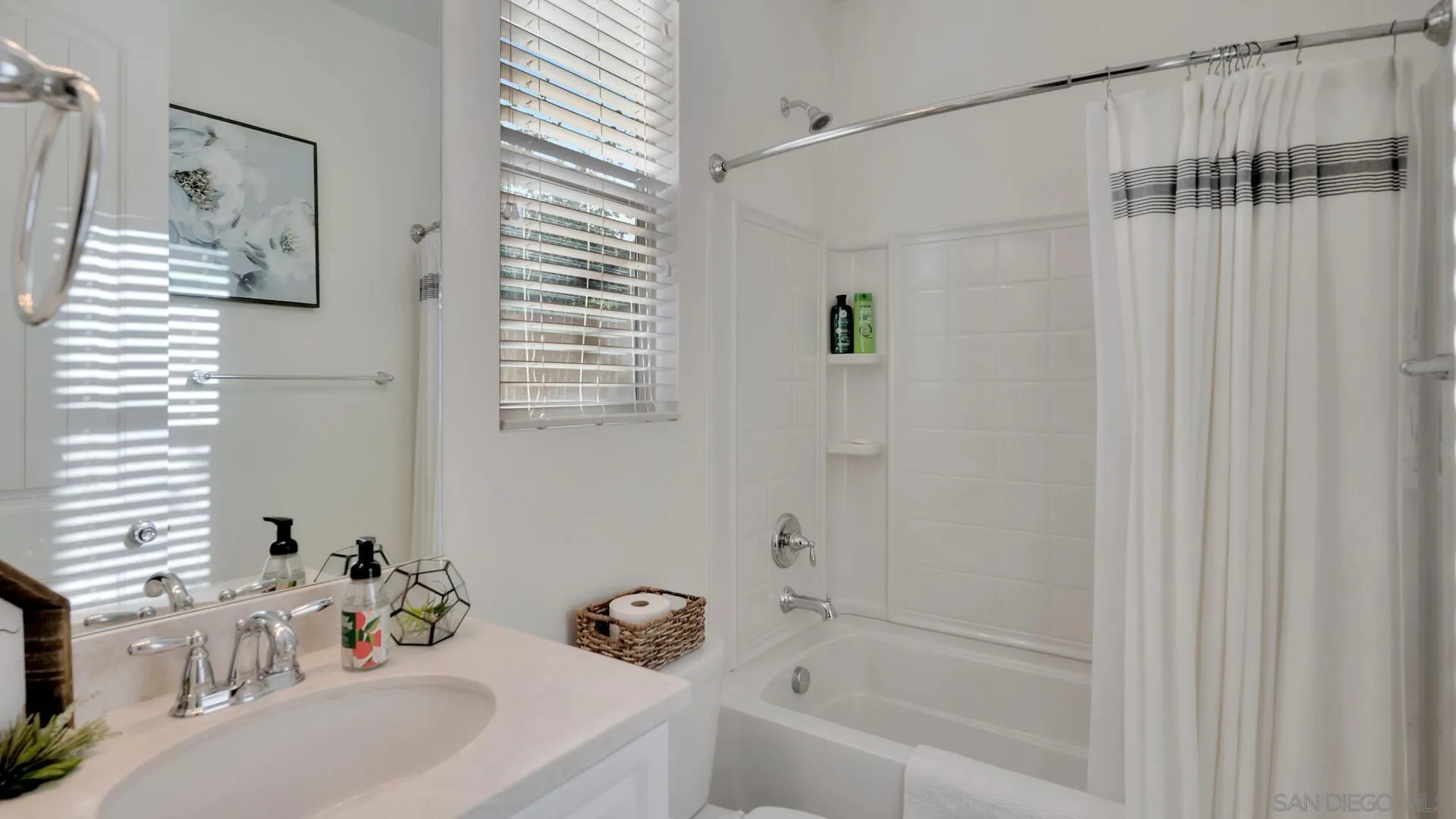 17568 Ralphs Ranch Road San Diego, CA 92127 - Photo 14 of 59 a bathroom with a sink a toilet and shower