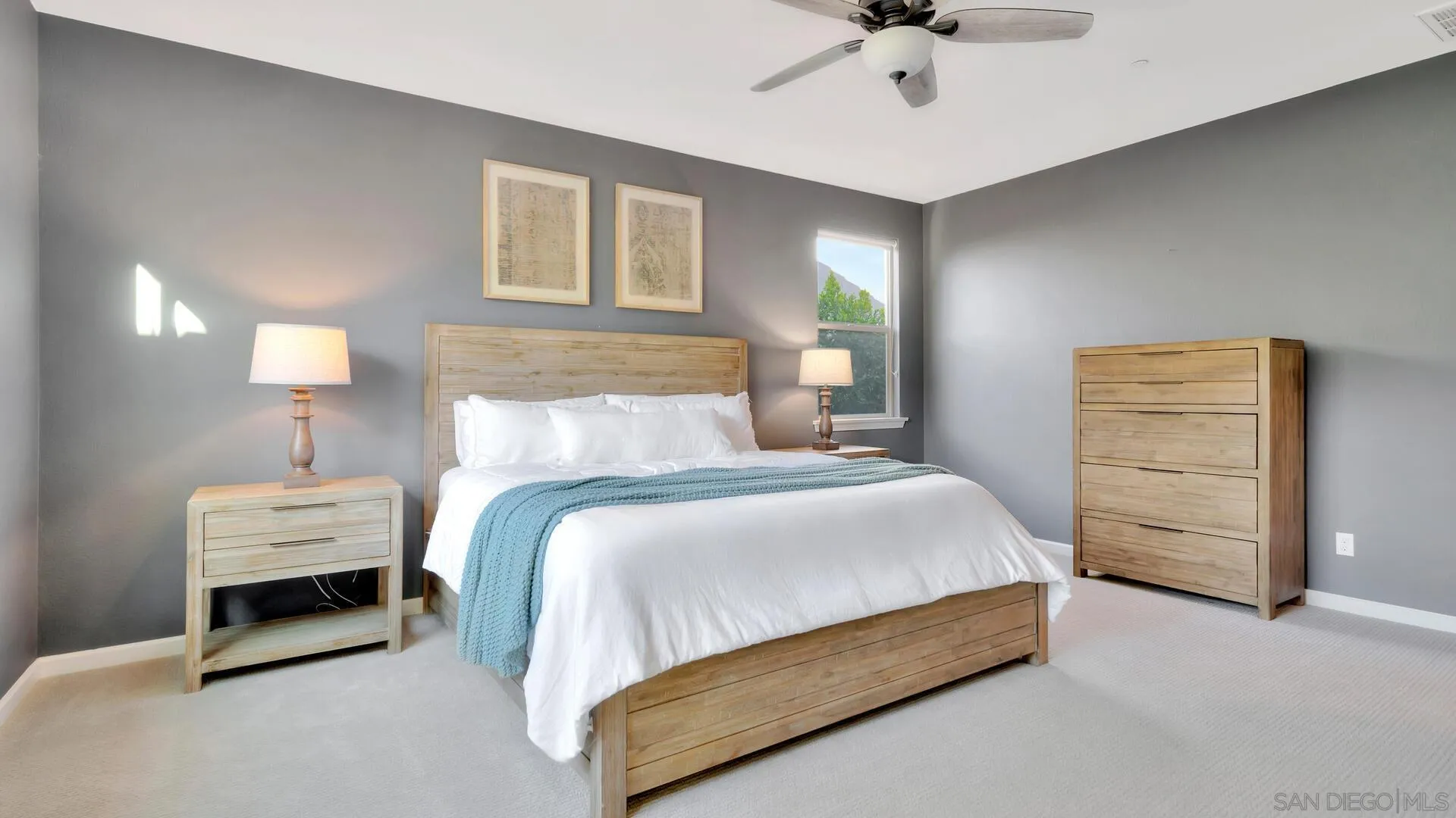 17568 Ralphs Ranch Road San Diego, CA 92127 - Photo 17 of 59 a bedroom with bed and a ceiling fan