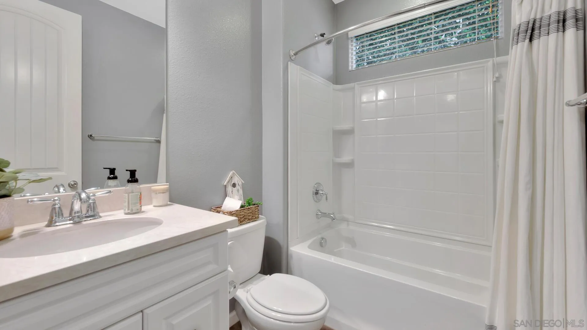 17568 Ralphs Ranch Road San Diego, CA 92127 - Photo 23 of 59 a bathroom with a sink a toilet and shower