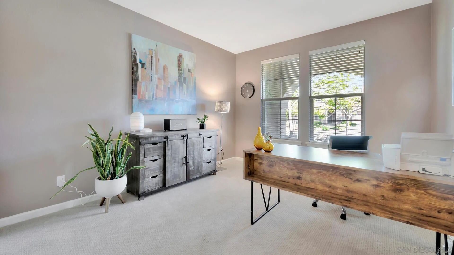 17568 Ralphs Ranch Road San Diego, CA 92127 - Photo 25 of 59 a living room with furniture and a potted plant