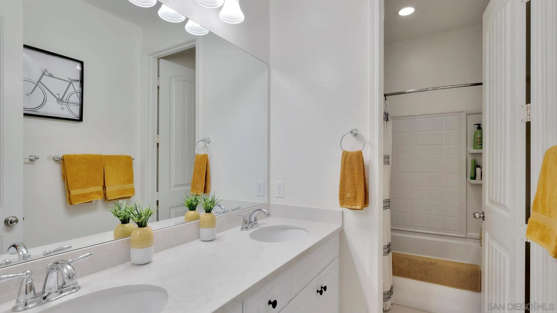 17568 Ralphs Ranch Road San Diego, CA 92127 - Photo 32 of 59 a bathroom with a sink and a mirror