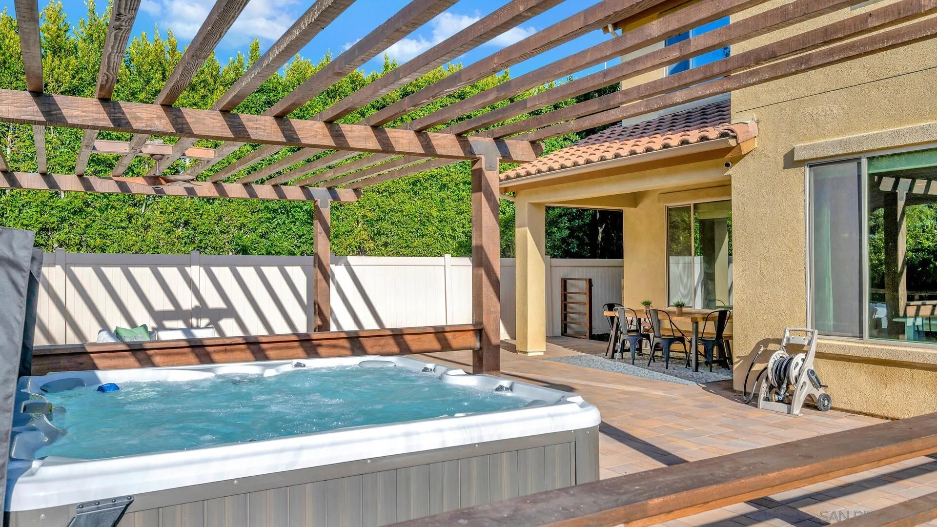 17568 Ralphs Ranch Road San Diego, CA 92127 - Photo 39 of 59 a view of a house with a patio