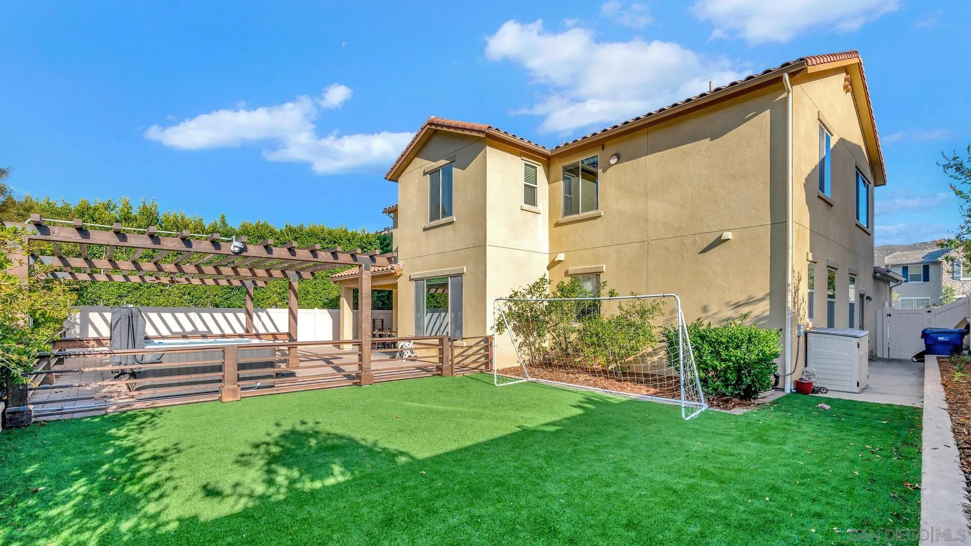 17568 Ralphs Ranch Road San Diego, CA 92127 - Photo 44 of 59 a front view of a house with a yard