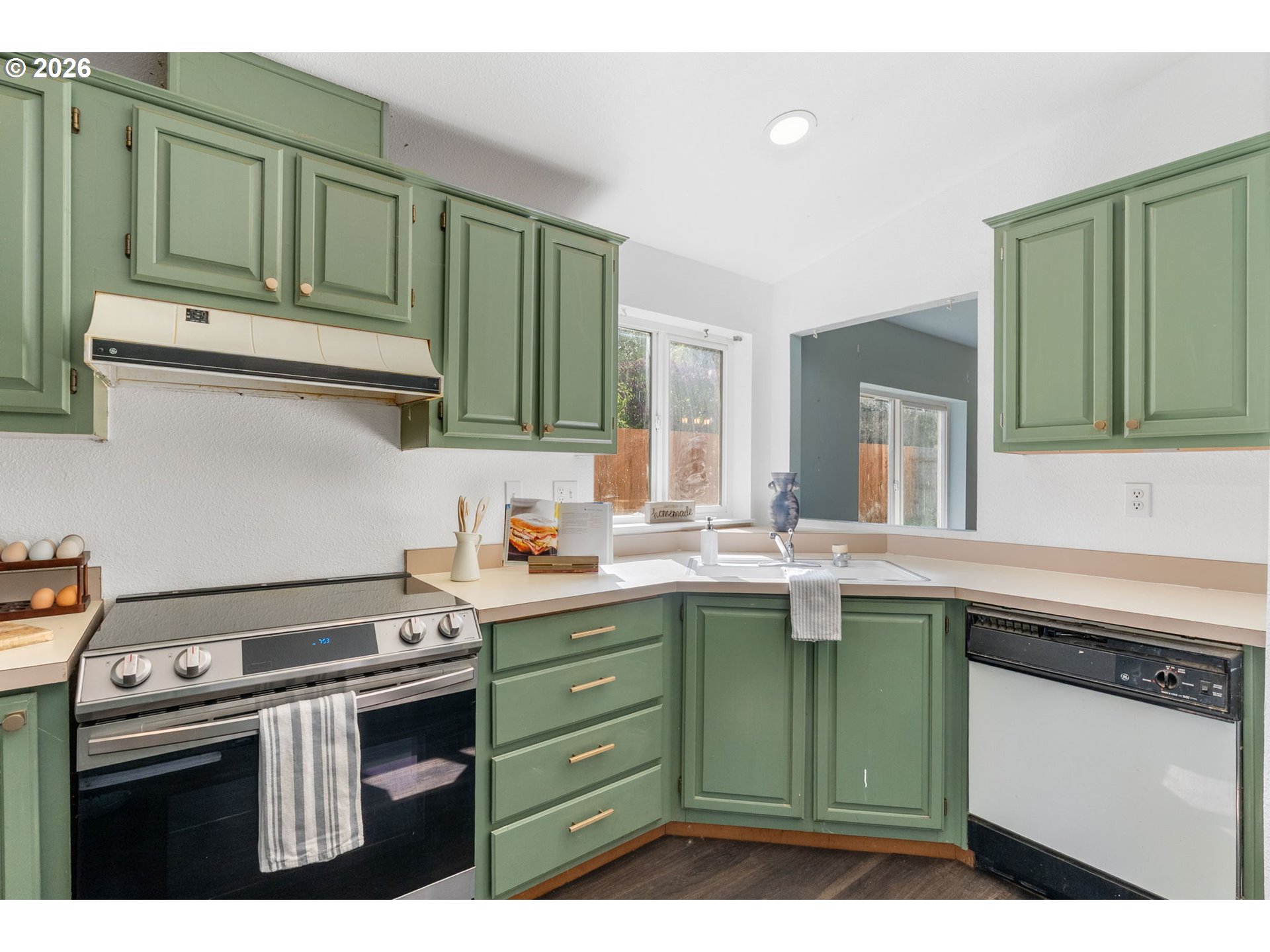 11 2nd Street Carson, WA 98610 - Photo 11 of 40 a kitchen with stainless steel appliances granite countertop a sink stove and cabinets