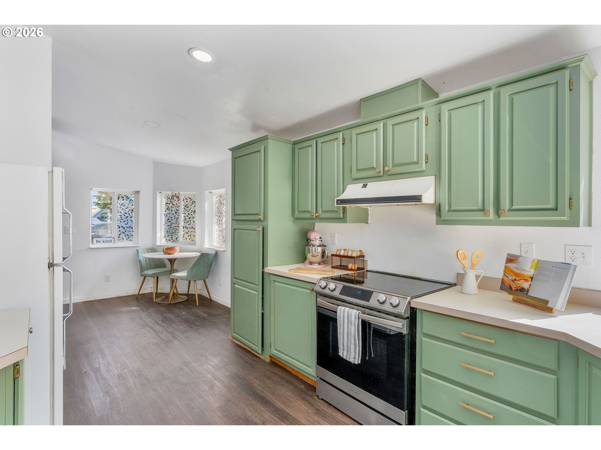 11 2nd Street Carson, WA 98610 - Photo 12 of 40 a kitchen with a stove a sink and cabinets
