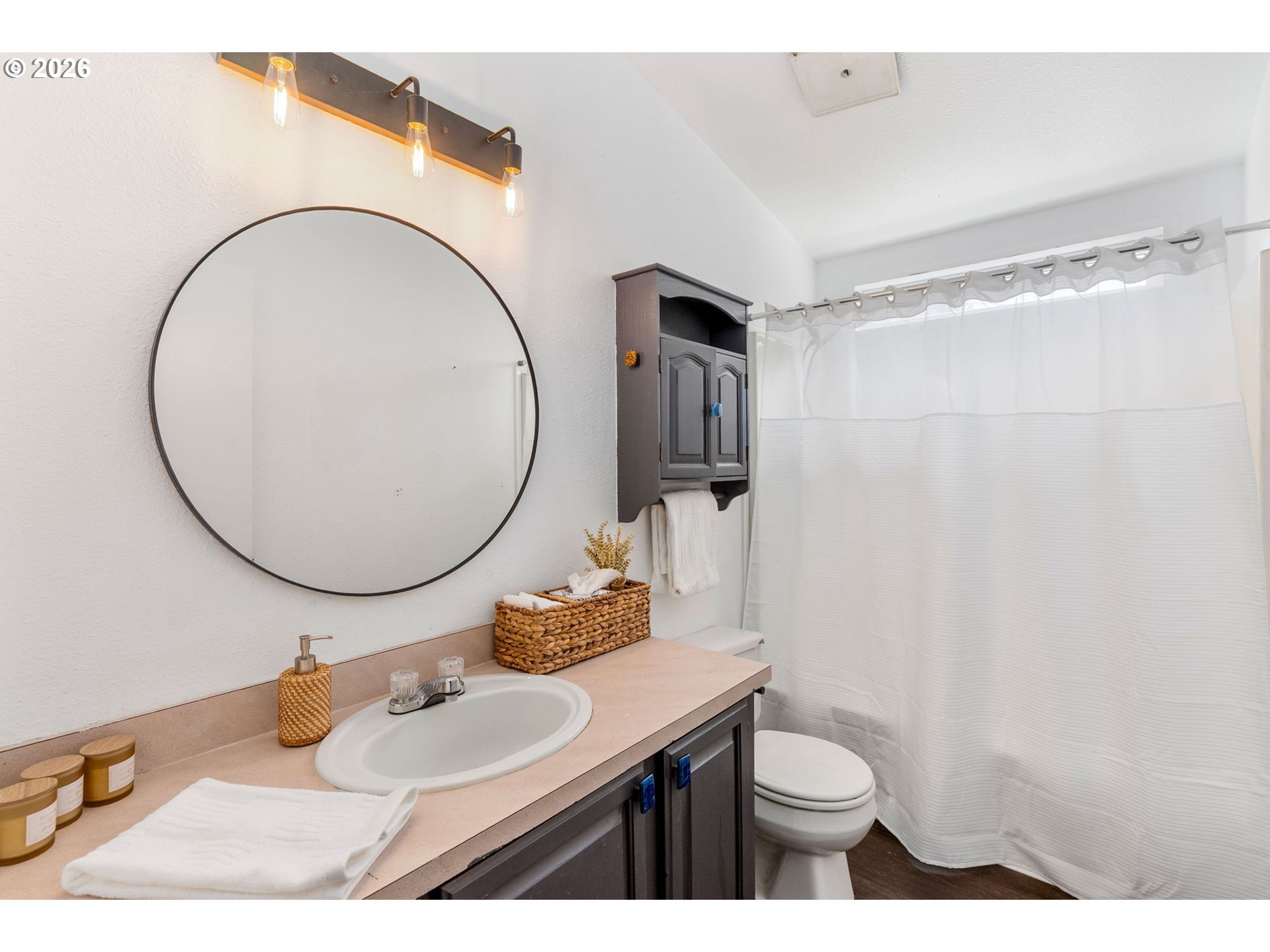 11 2nd Street Carson, WA 98610 - Photo 20 of 40 a bathroom with a sink a toilet and a mirror
